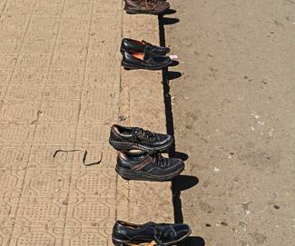 MAD-8833 Tinopener and Four Pairs of Shoes, Street Market, Asmara
