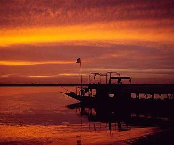 sunsetboat Sunset on the River Niger