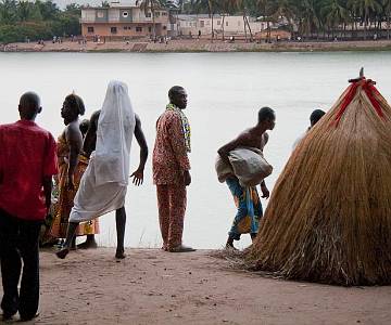 IMG-4152 Zangbetto, the 'Night Police', manifesting himself as a fetish dressed in straw. Lome, Togo.
