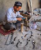 Gewgaws, Trinkets and Other Things    Knife Maker, Xinjiang, China    MUS-8752.jpg  &copy 1990-2015 AJ Rye : gewgaw