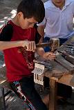 Ritual, from Many Religions    Boy making Koran bookstand; Uzbekistan    MUS-7443.jpg  &copy 1990-2015 AJ Rye : ritual